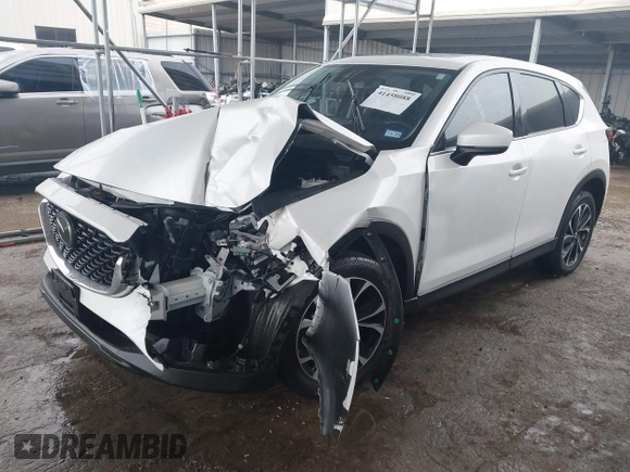 2023 Mazda CX-5 2.5 S Premium Package with VIN JM3KFBDM7P0165562, listed as a IAAI auction lot 41458088 with 35,168 mi miles. Bid and sale history available at carsss.com. Image 17.