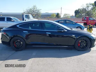 2014 Tesla Model S P85D with VIN 5YJSA1H22EFP65530, listed as a IAAI auction lot 41959941 with 76,532 mi miles and . Bid and sale history available at DreamBid. Image 13.