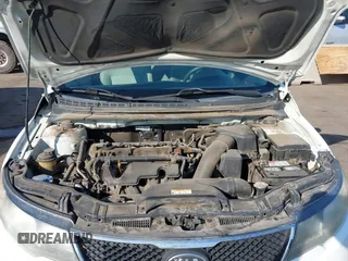 2010 Kia Forte EX with VIN KNAFU4A27A5310573, listed as a IAAI auction lot 41398134 with 167,264 mi miles. Bid and sale history available at carsss.com. Image 10.