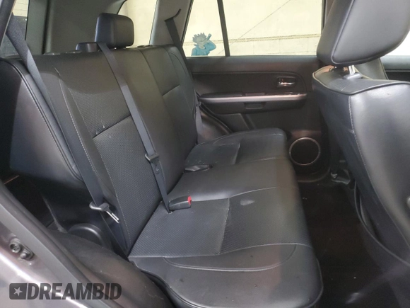 2012 Suzuki Grand Vitara Limited z VIN JS3TE0D78C4100383, wystawiony jako Copart lot #49240925 z przebiegiem 175 570 mil mil oraz Czysty tytuł • Clean title. Historia ofert i sprzedaży dostępna na DreamBid. Obrazek 11.