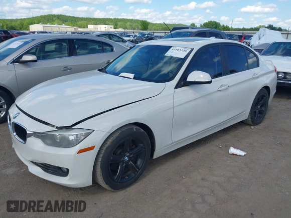 2014 BMW 3 Series 328i with VIN WBA3A5C5XEJ463938, listed as a IAAI auction lot 42103330 with 194,263 mi miles and . Bid and sale history available at DreamBid. Image 2.