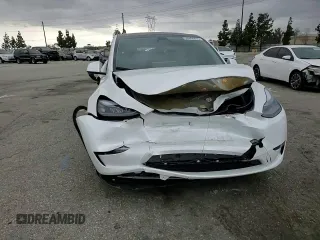 2024 Tesla Model Y Long Range with VIN 7SAYGDEE8RF088808, listed as a Copart auction lot 50406865 with 8,150 mi miles and Salvage title. Bid and sale history available at DreamBid. Image 11.