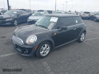 2013 MINI Cooper Hardtop with VIN WMWSU3C50DT682238, listed as a IAAI auction lot 41919592 with 148,035 mi miles. Bid and sale history available at carsss.com. Image 2.