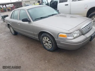 2005 Ford Crown Victoria LX with VIN 2FAFP74W05X174758, listed as a IAAI auction lot 41553606 with 192,103 mi miles. Bid and sale history available at carsss.com. Image 1.