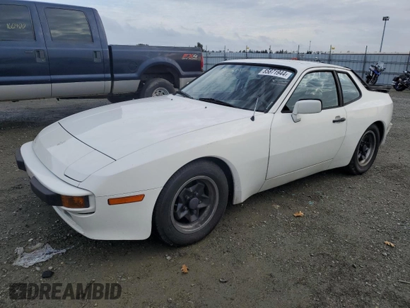 1984 Porsche 944 with VIN WP0AA0944EN453622, listed as a Copart auction lot 85871944 with 92,382 mi miles and Salvage Title. Bid and sale history available at DreamBid. Image 1.