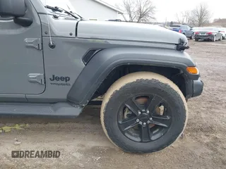2021 Jeep Wrangler Unlimited Sport Altitude with VIN 1C4HJXDG1MW603784, listed as a IAAI auction lot 41509231 with 102,567 mi miles and . Bid and sale history available at DreamBid. Image 18.