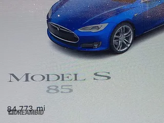 2013 Tesla Model S with VIN 5YJSA1CNXDFP06077, listed as a IAAI auction lot 41958105 with 84,773 mi miles. Bid and sale history available at carsss.com. Image 15.