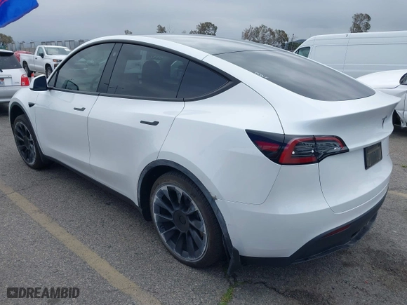 2023 Tesla Model Y Long Range with VIN 7SAYGDEE7PA023295, listed as a IAAI auction lot 41773783 with 28,079 mi miles. Bid and sale history available at carsss.com. Image 3.