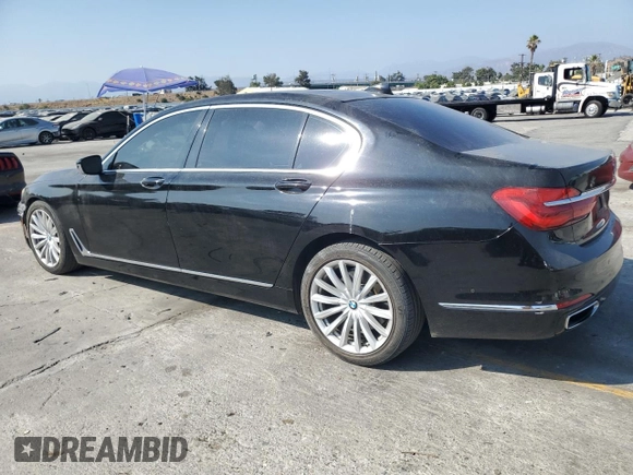 2017 BMW 7 Series 740i with VIN WBA7E2C50HG739565, listed as a Copart auction lot 64584885 with 114,496 mi miles and Salvage title. Bid and sale history available at DreamBid. Image 2.