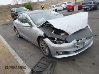 2017 Tesla Model S 60 with VIN 5YJSA1E17HF189627, listed as a IAAI auction lot 41891766 with 106,003 mi miles and . Bid and sale history available at DreamBid. Image 1.