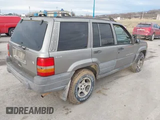 1997 Jeep Grand Cherokee Laredo with VIN 1J4GZ58S4VC745129, listed as a IAAI auction lot 41641005 with 1 mi miles. Bid and sale history available at carsss.com. Image 4.