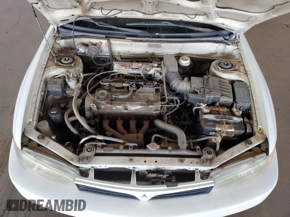 2001 Mitsubishi Mirage ES z VIN JA3AY26CX1U013535, wystawiony jako Copart lot #57664885 z przebiegiem 159 095 mil mil oraz Szkoda całkowita • Salvage title. Historia ofert i sprzedaży dostępna na DreamBid. Obrazek 11.