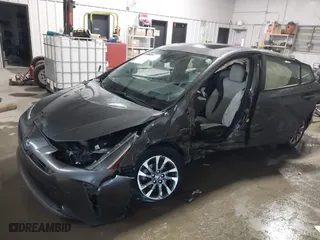 2021 Toyota Prius L Eco with VIN JTDKAMFU9M3132587, listed as a IAAI auction lot 41637275 with 84,203 mi miles. Bid and sale history available at carsss.com. Image 6.