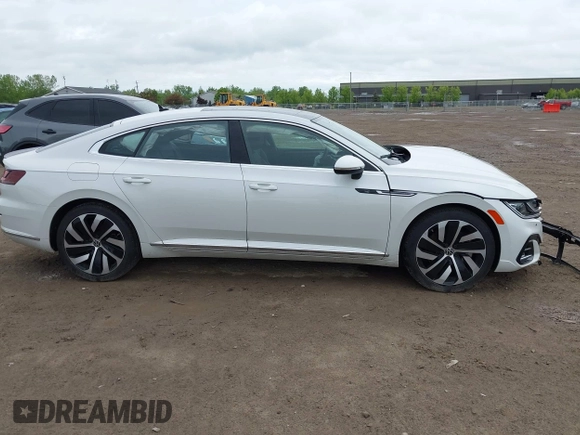 2021 Volkswagen Arteon SEL R-Line z VIN WVWSR7AN6ME007156, wystawiony jako IAAI lot #42254735 z przebiegiem 32 004 mil mil oraz . Historia ofert i sprzedaży dostępna na DreamBid. Obrazek 14.