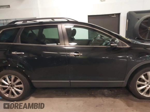 2015 Mazda CX-9 Grand Touring with VIN JM3TB3DV3F0460493, listed as a IAAI auction lot 41053565 with 213,124 mi miles. Bid and sale history available at carsss.com. Image 13.