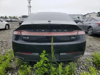 2016 Lincoln MKZ Hybrid z VIN 3LN6L2LU2GR617577, wystawiony jako Copart lot #57604665 z przebiegiem 142 876 mil mil oraz Tytuł czysty. Historia ofert i sprzedaży dostępna na DreamBid. Obrazek 6.