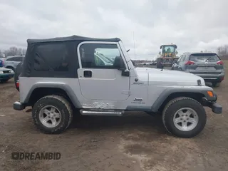 2004 Jeep Wrangler Sport with VIN 1J4FA49S64P749380, listed as a IAAI auction lot 41935405 with 84,690 mi miles. Bid and sale history available at carsss.com. Image 13.