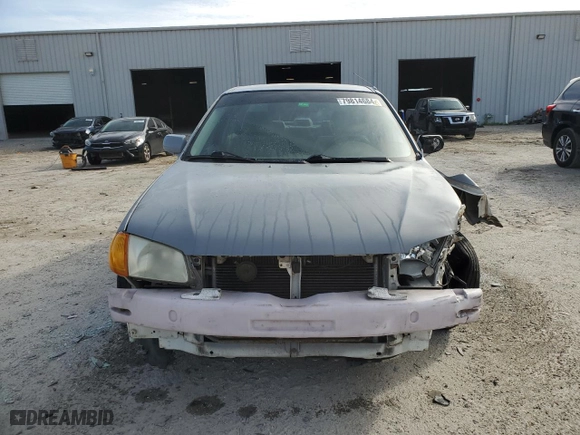 2000 Mazda Protege DX with VIN JM1BJ2221Y0310055, listed as a Copart auction lot 79814684 with 144,173 mi miles and Salvage Title. Bid and sale history available at carsss.com. Image 5.