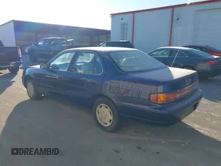 1994 Toyota Camry LE with VIN 4T1SK12EXRU374215, listed as a IAAI auction lot 41581093 with 80,397 mi miles. Bid and sale history available at carsss.com. Image 3.