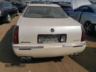2000 Cadillac Eldorado z VIN 1G6EL12Y2YU179560, wystawiony jako Copart lot #70635784 z przebiegiem 92 959 mil mil oraz Tytuł czysty. Historia ofert i sprzedaży dostępna na DreamBid. Obrazek 6.