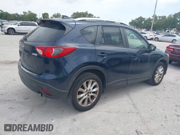 2014 Mazda CX-5 Grand Touring with VIN JM3KE2DY8E0425258, listed as a IAAI auction lot 42179452 with 132,137 mi miles. Bid and sale history available at carsss.com. Image 4.