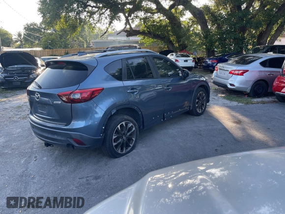 2016 Mazda CX-5 Grand Touring with VIN JM3KE4DY9G0673789, listed as a IAAI auction lot 42196841 with 98,622 mi miles and . Bid and sale history available at DreamBid. Image 4.