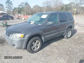 2006 Ford Escape XLT with VIN 1FMYU03Z56KC55074, listed as a IAAI auction lot 41473454 with 164,399 mi miles. Bid and sale history available at carsss.com. Image 2.