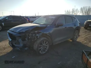 2020 Mazda CX-5 Grand Touring with VIN JM3KFBDM1L0727482, listed as a Copart auction lot 82976114 with 103,707 mi miles and Salvage Title. Bid and sale history available at carsss.com. Image 1.