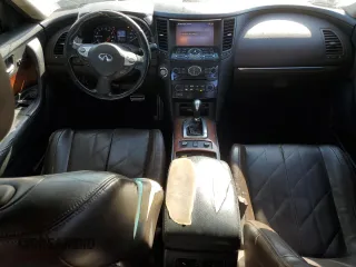 2014 Infiniti QX70 z VIN JN8CS1MU1EM451632, wystawiony jako Copart lot #50012035 z przebiegiem 246 212 mil mil oraz Szkody całkowita. Historia ofert i sprzedaży dostępna na DreamBid. Obrazek 8.