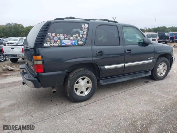 2005 GMC Yukon SLT with VIN 1GKEC13T15J221363, listed as a IAAI auction lot 41388170 with 233,577 mi miles. Bid and sale history available at carsss.com. Image 4.