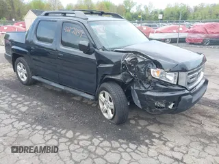 2011 Honda Ridgeline RTL with VIN 5FPYK1F54BB009852, listed as a IAAI auction lot 42171137 with 122,477 mi miles and . Bid and sale history available at DreamBid. Image 1.