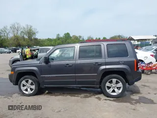 2014 Jeep Patriot Latitude with VIN 1C4NJRFB3ED847997, listed as a IAAI auction lot 42109140 with 121,299 mi miles and . Bid and sale history available at carsss.com. Image 14.