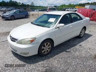 2004 Toyota Camry LE with VIN JTDBE32KX40279599, listed as a IAAI auction lot 42202160 with 288,879 mi miles and . Bid and sale history available at carsss.com. Image 2.