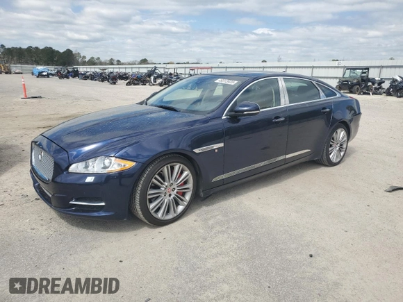 2015 Jaguar XJ Portfolio with VIN SAJWJ2GD8F8V84252, listed as a Copart auction lot 49313935 with 90,545 mi miles and Salvage title. Bid and sale history available at DreamBid. Image 1.