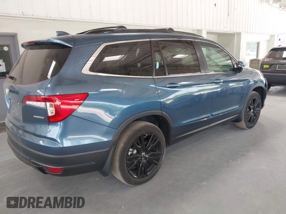 2021 Honda Pilot Special Edition with VIN 5FNYF5H27MB011413, listed as a IAAI auction lot 42082680 with 27,474 mi miles and . Bid and sale history available at carsss.com. Image 4.