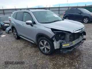 2019 Subaru Forester Touring with VIN JF2SKAWC0KH401242, listed as a IAAI auction lot 42412461 with 114,389 mi miles and . Bid and sale history available at DreamBid. Image 1.