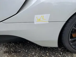 2015 BMW i8 z VIN WBY2Z2C56FV392042, wystawiony jako Copart lot #66972874 z przebiegiem Nie podano mil oraz Szkoda całkowita • Salvage title. Historia ofert i sprzedaży dostępna na DreamBid. Obrazek 12.