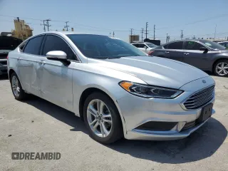 2018 Ford Fusion SE z VIN 3FA6P0LU8JR110693, wystawiony jako Copart lot #61931995 z przebiegiem 119 629 mil mil oraz Szkoda całkowita • Salvage title. Historia ofert i sprzedaży dostępna na DreamBid. Obrazek 4.