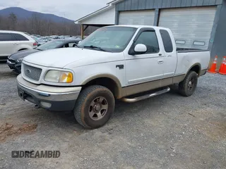 1999 Ford F-150 XL with VIN 1FTRX18LXXKA75357, listed as a IAAI auction lot 41630371 with 202,021 mi miles. Bid and sale history available at carsss.com. Image 18.