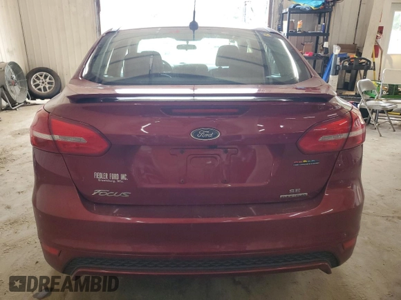 2016 Ford Focus SE with VIN 1FADP3F26GL253961, listed as a Copart auction lot 61583695 with 191,540 mi miles and Salvage title. Bid and sale history available at DreamBid. Image 6.