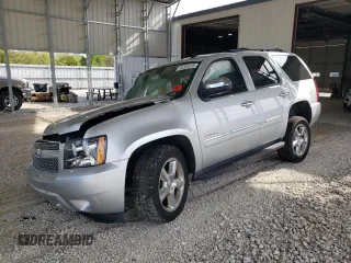 2014 Chevrolet Tahoe LTZ with VIN 1GNSKCE01ER145779, listed as a Copart auction lot 54163315 with 216,225 mi miles and Salvage title. Bid and sale history available at DreamBid. Image 1.