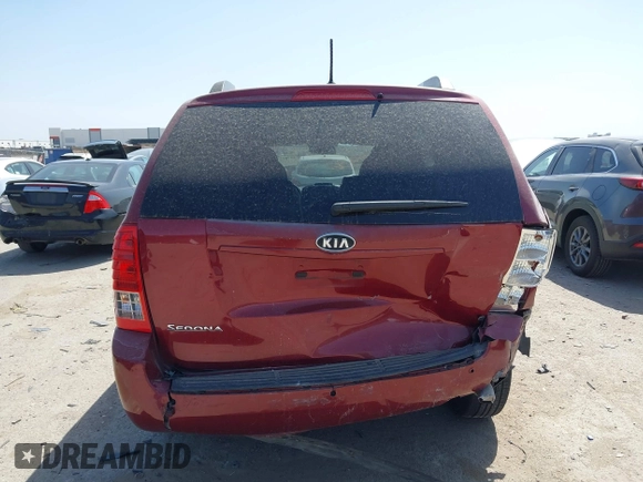 2012 Kia Sedona LX with VIN KNDMG4C70C6463190, listed as a IAAI auction lot 41781336 with 179,860 mi miles. Bid and sale history available at carsss.com. Image 16.