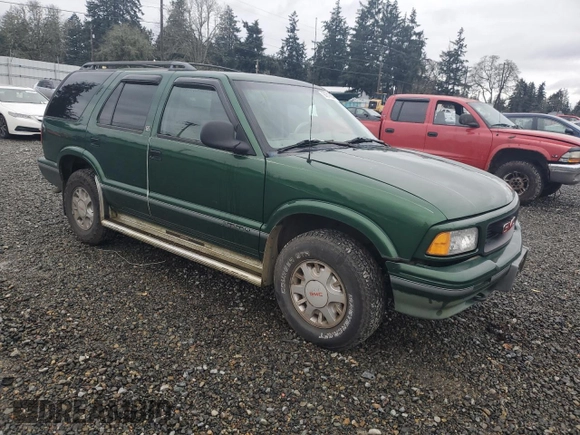 1997 GMC Jimmy SLS with VIN 1GKDT13WXV2563104, listed as a Copart auction lot 86317834 with 121,791 mi miles and Salvage Title. Bid and sale history available at carsss.com. Image 4.