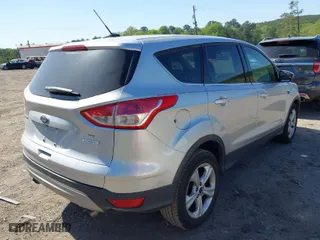 2014 Ford Escape SE with VIN 1FMCU0GX4EUD22334, listed as a IAAI auction lot 42007641 with 146,573 mi miles. Bid and sale history available at carsss.com. Image 4.