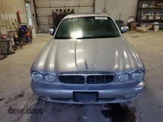 2004 Jaguar XJ with VIN SAJEA71C84SG07220, listed as a Copart auction lot 70916164 with 151,102 mi miles and Salvage Title. Bid and sale history available at carsss.com. Image 5.