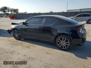 2015 Scion tC with VIN JTKJF5C79FJ003581, listed as a Copart auction lot 52973655 with 106,641 mi miles and Salvage Title. Bid and sale history available at carsss.com. Image 2.