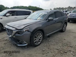 2018 Mazda CX-9 Grand Touring z VIN JM3TCBDY9J0208533, wystawiony jako Copart lot #59854635 z przebiegiem 90 263 mil mil oraz Szkoda całkowita • Salvage title. Historia ofert i sprzedaży dostępna na DreamBid. Obrazek 1.