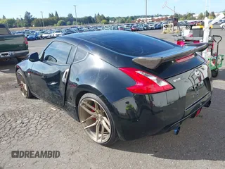 2013 Nissan 370Z with VIN JN1AZ4EH1DM880739, listed as a IAAI auction lot 40474120 with 76,369 mi miles. Bid and sale history available at carsss.com. Image 3.