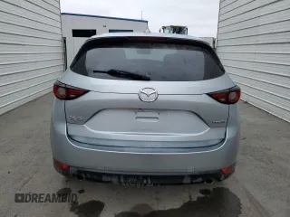 2021 Mazda CX-5 Grand Touring z VIN JM3KFADM7M1339081, wystawiony jako Copart lot #58913585 z przebiegiem Nie podano mil oraz Szkoda całkowita • Salvage title. Historia ofert i sprzedaży dostępna na DreamBid. Obrazek 6.