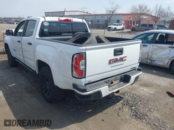 2021 GMC Canyon 4WD AT4 z VIN 1GTG6FENXM1291689, wystawiony jako IAAI lot #42038884 z przebiegiem 54 884 mil mil oraz . Historia ofert i sprzedaży dostępna na DreamBid. Obrazek 3.